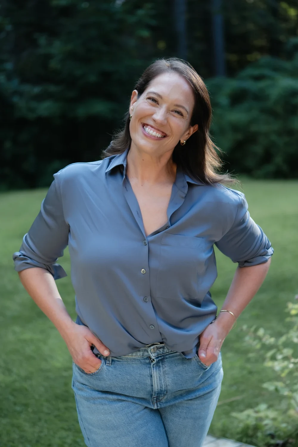 Annie Wright smiling outdoors in a blue blouse.