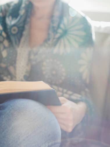 Image of a woman reading a book, representing a feeling memory.