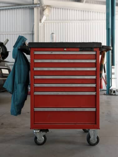 Image of a red metal mobile tool chest representing the concept of relational trauma support with self-care tools.