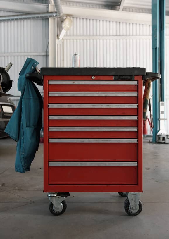 Image of a red metal mobile tool chest representing the concept of relational trauma support with self-care tools.