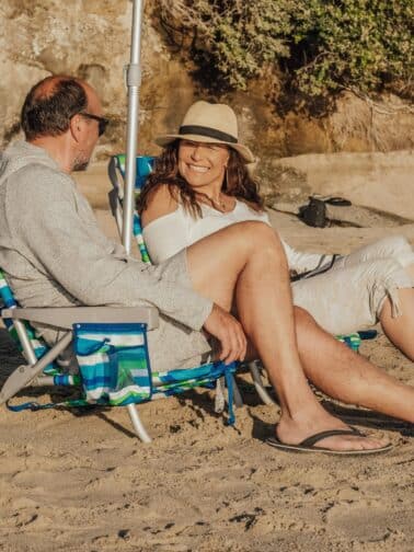 A man and woman share a serene moment on beach chairs symbolizing the power of connection in relationships, where professional strengths should be balanced with emotional presence and trust.