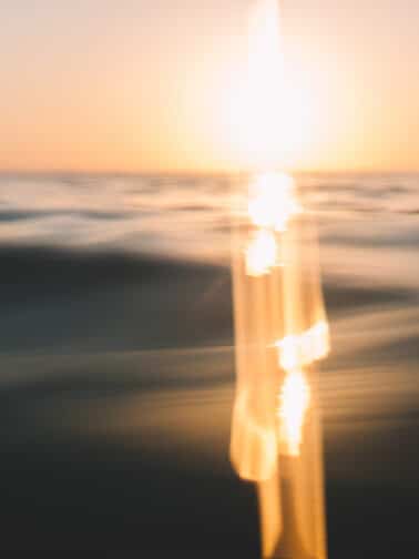 In water angle of the sunset over the indian ocean, bali.