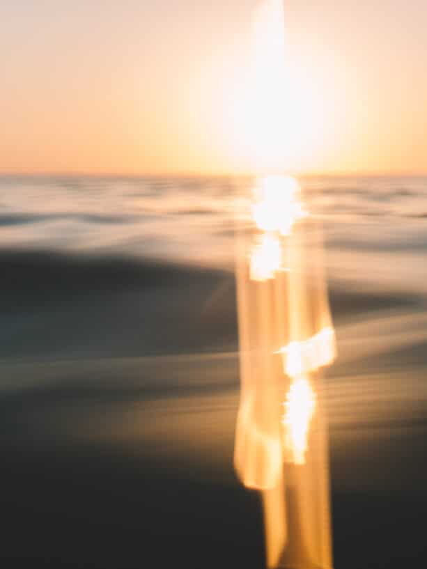 In water angle of the sunset over the indian ocean, bali.
