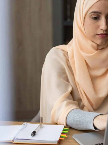 A determined woman balancing ambition and well-being, symbolizing the struggle against workaholism.