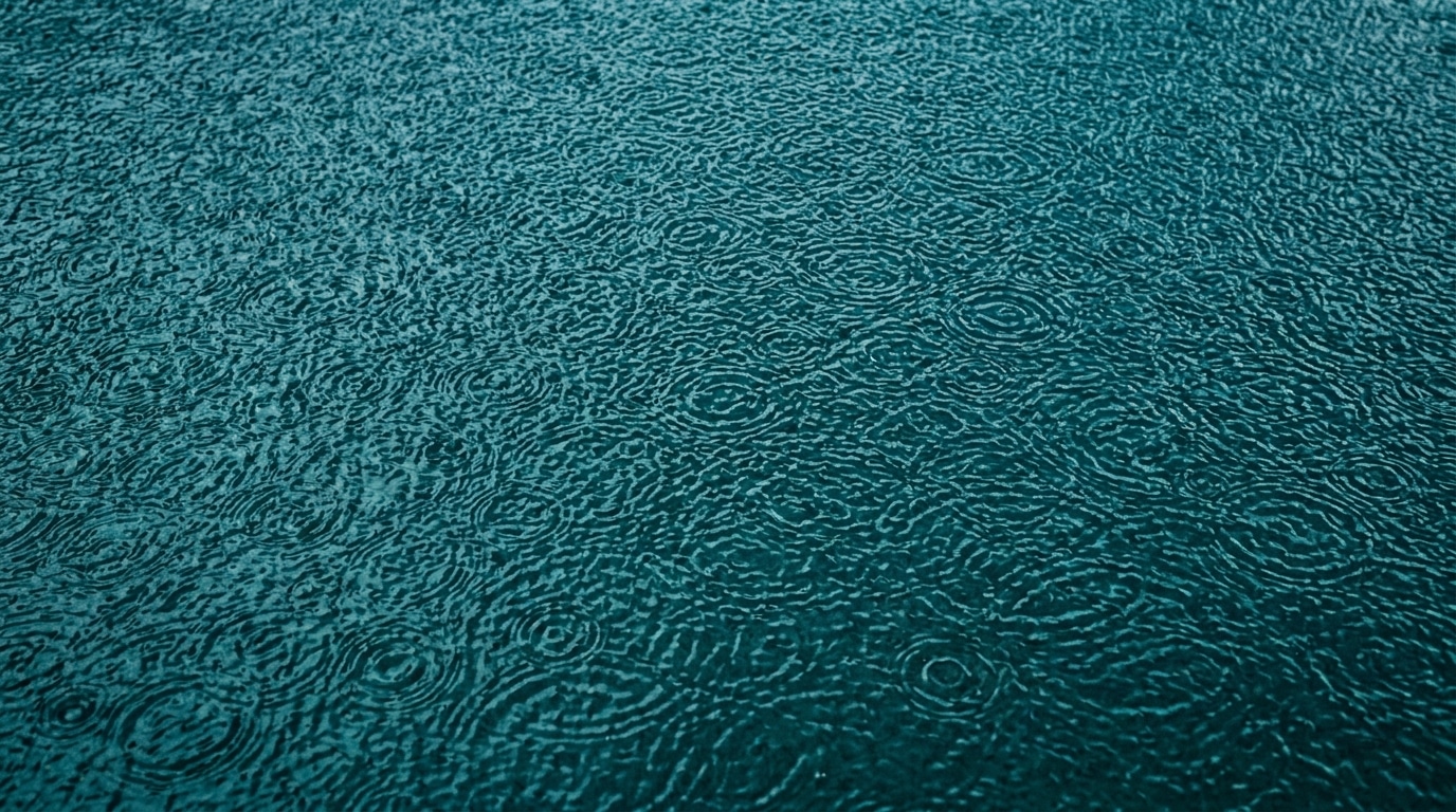 Abstract rain on teal surface