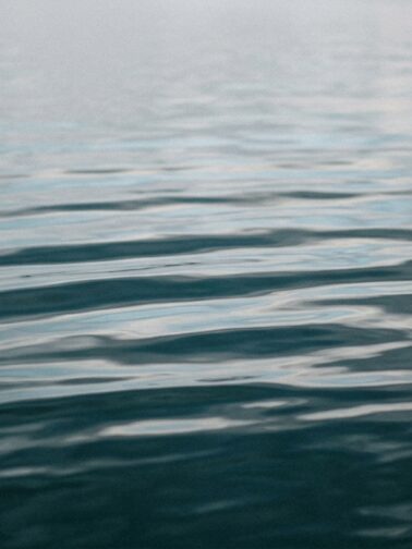 Water reflection pale grey sky