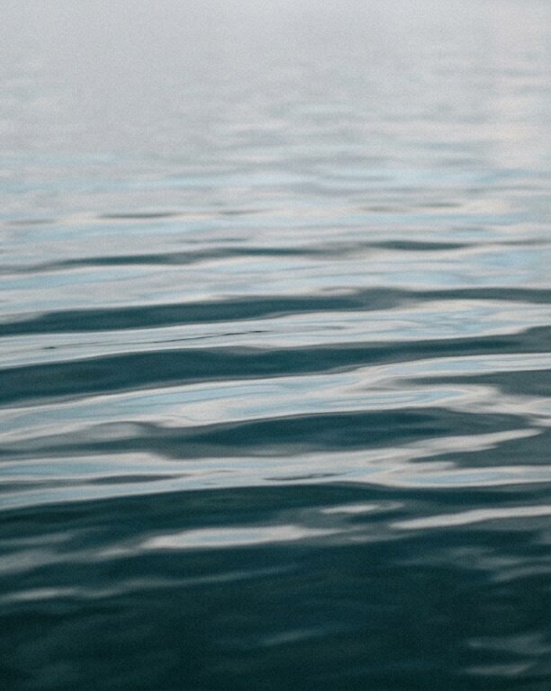 Water reflection pale grey sky