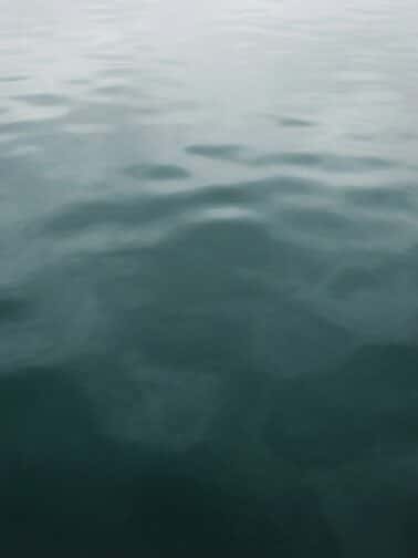 Meditative seascape with layered grey clouds