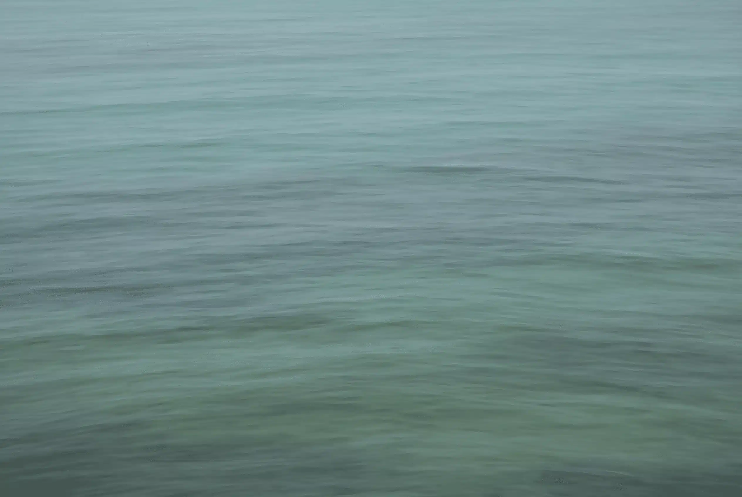 Woman sitting alone at a window at dusk, journaling — Annie Wright trauma therapy for narcissistic abuse survivors