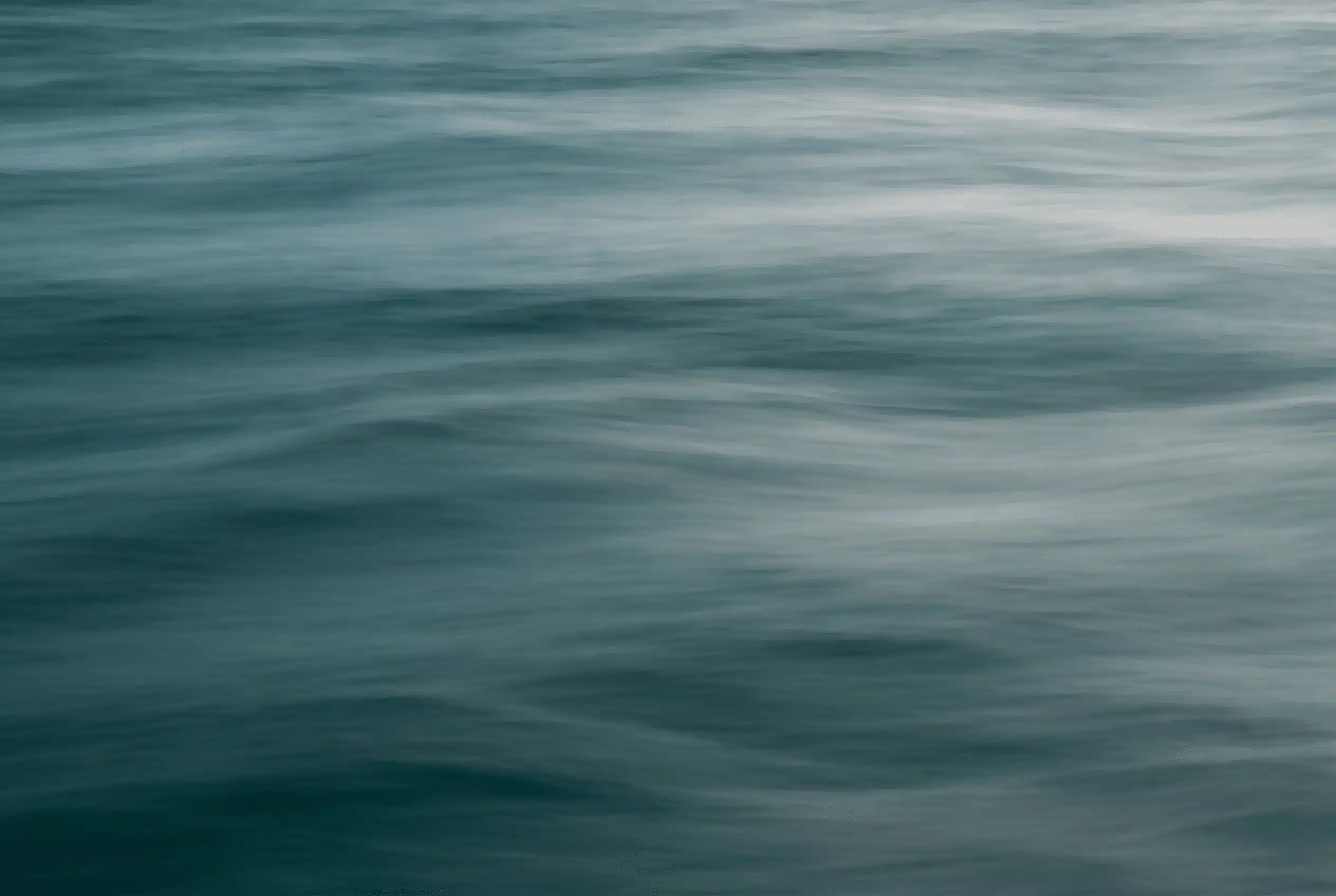 Soft morning light over still water — a moment of quiet hope and resilience — Annie Wright trauma therapy