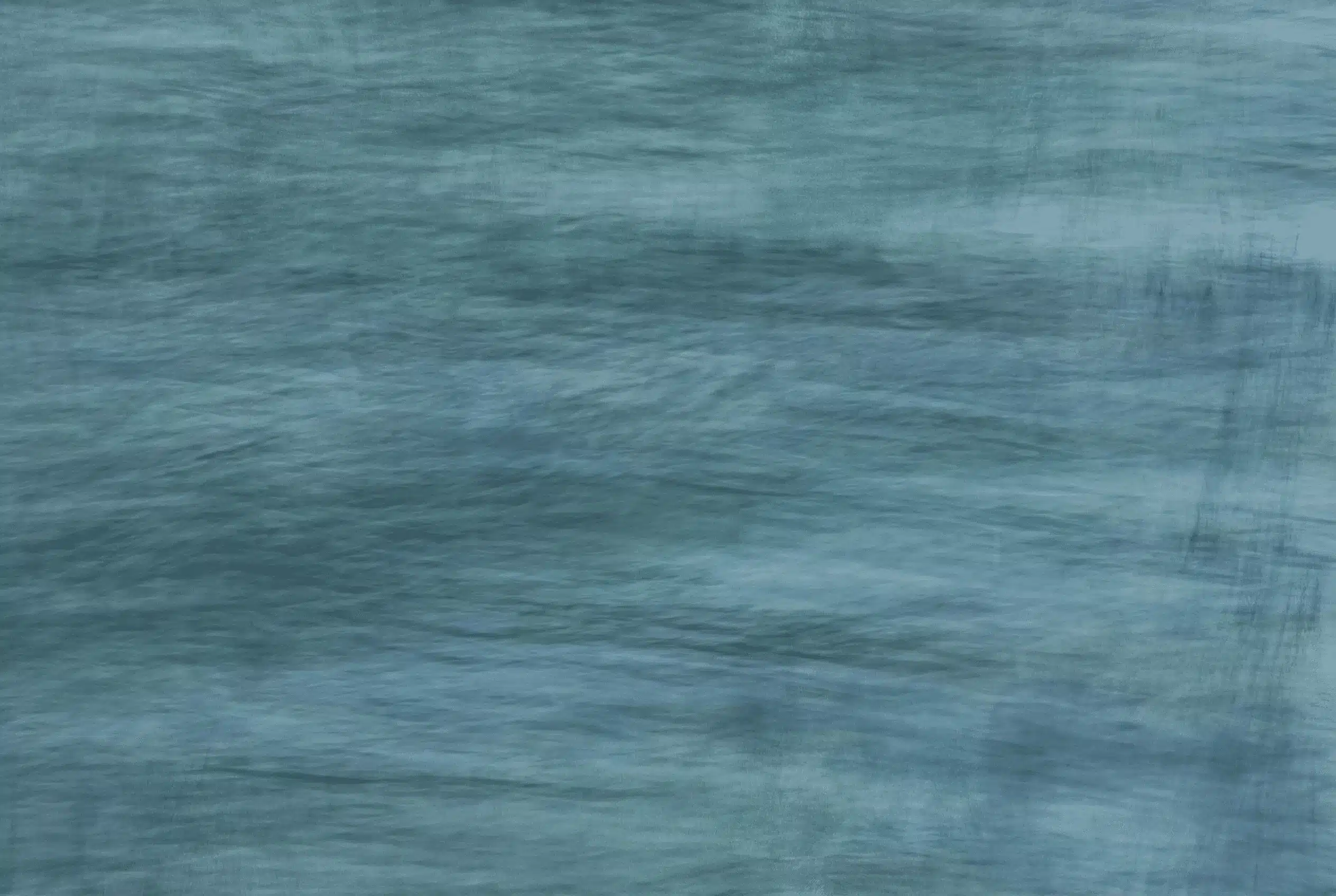 Woman physician standing at hospital window at dusk, looking out at the city — Annie Wright trauma therapy