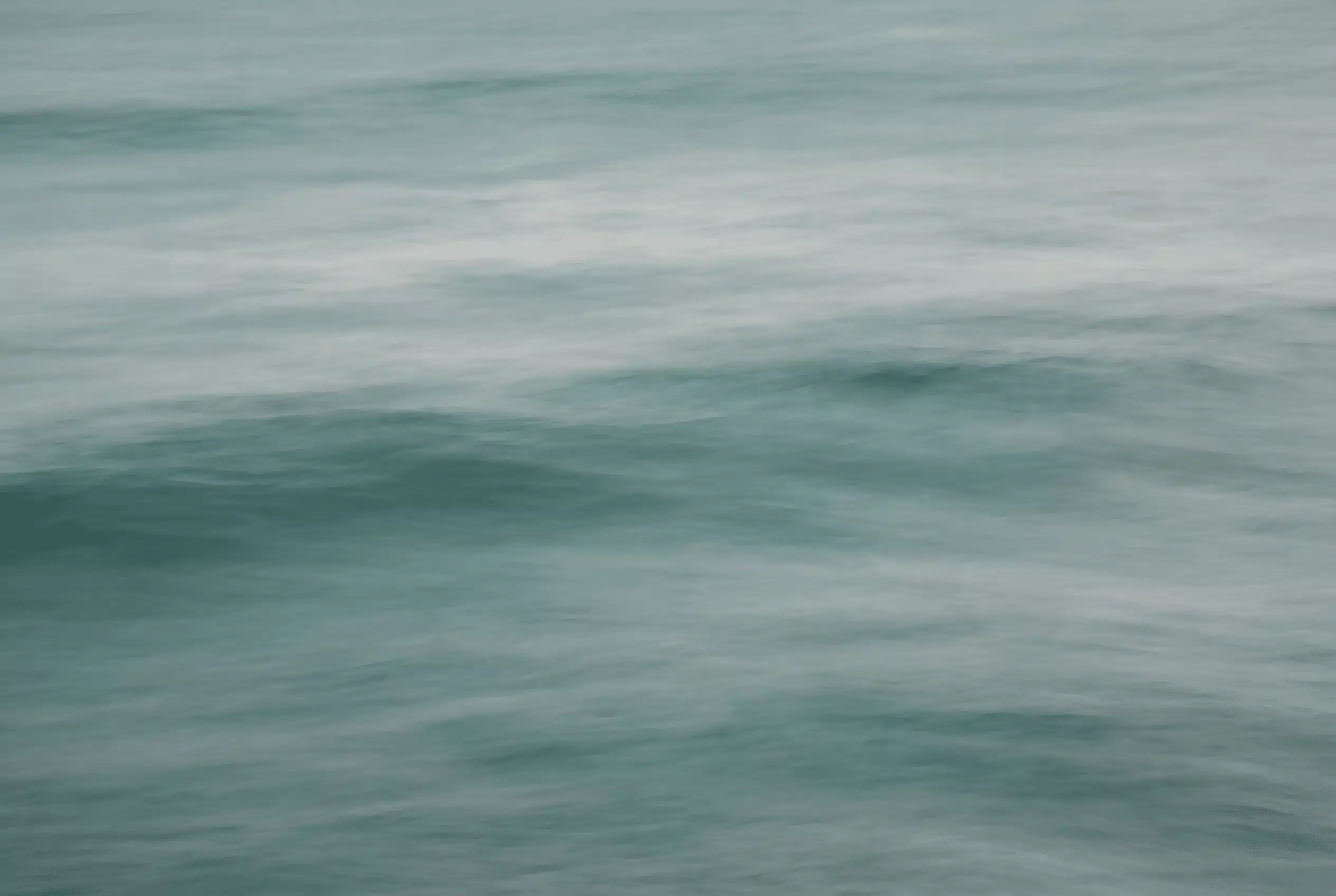 A woman sitting at a desk surrounded by books and notes on trauma recovery, looking for a structured path forward — Annie Wright trauma therapy